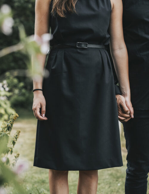Couple holding hands at a graveyard Couple holding hands at a graveyard