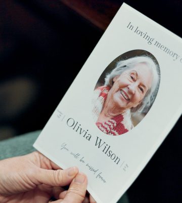 Funeral, photo and senior woman death in church with respect and farewell memorial. Goodbye, hands and chapel with sadness and mourning of grandmother with information and picture of elderly person